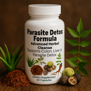 Parasite Detox Formula supplement bottle with herbs on a wooden background