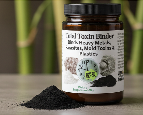 Bottle of Total Toxin Blaster on a table with bamboo in the background