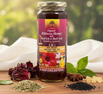 Jar of organic hibiscus honey with ingredients on a wooden surface